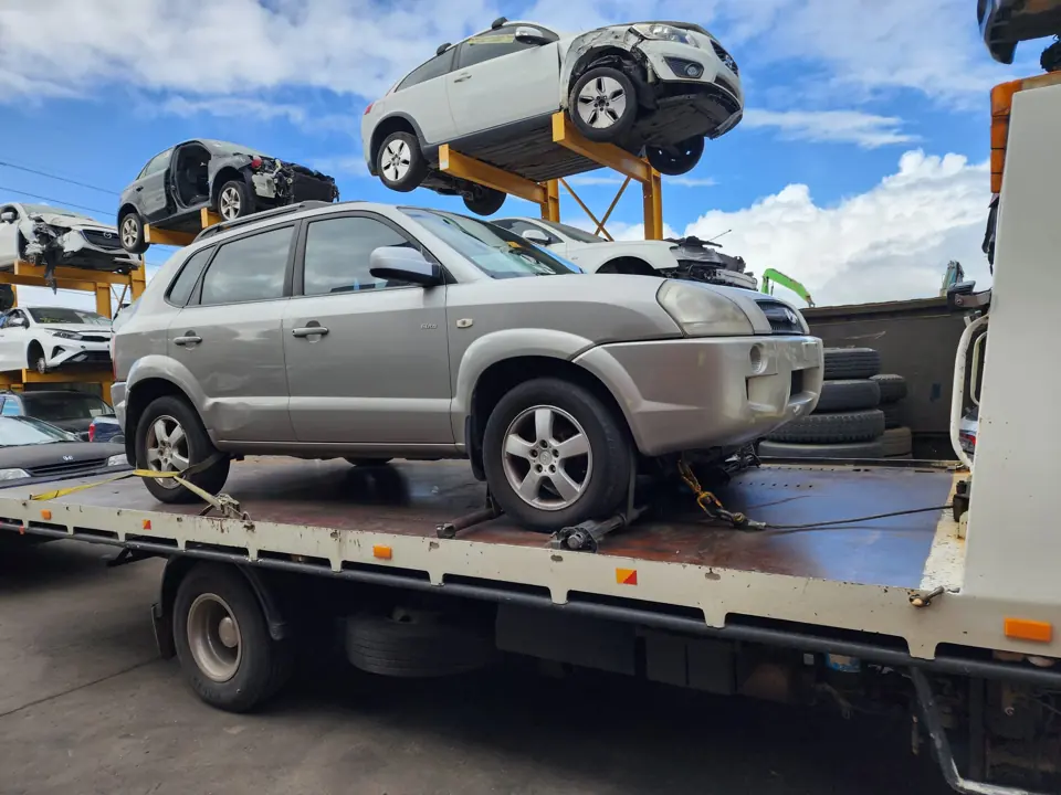 Silver SUV on a flatbed truck