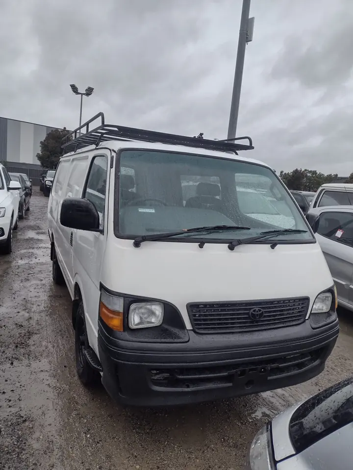 White van with roof racks