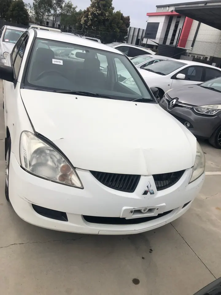 White sedan viewed from the front