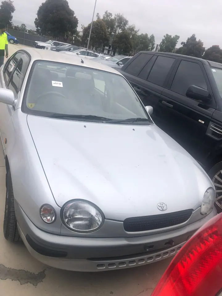 Silver hatchback in a vehicle yard