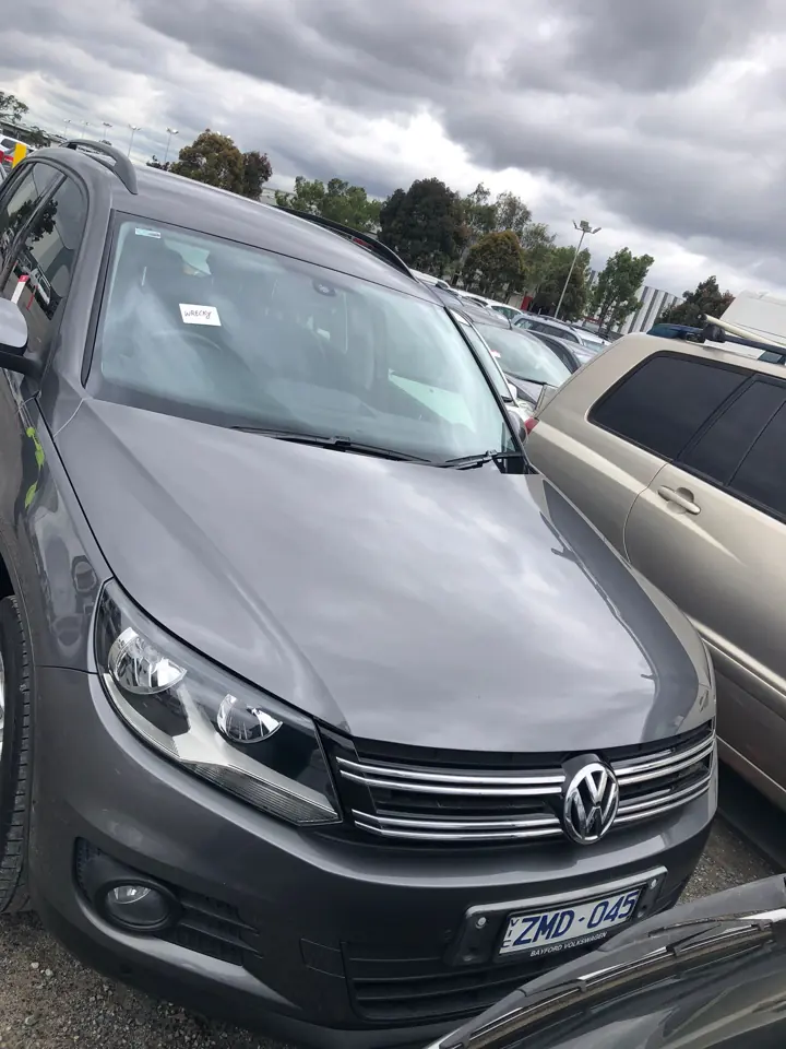 Grey wagon in a vehicle yard