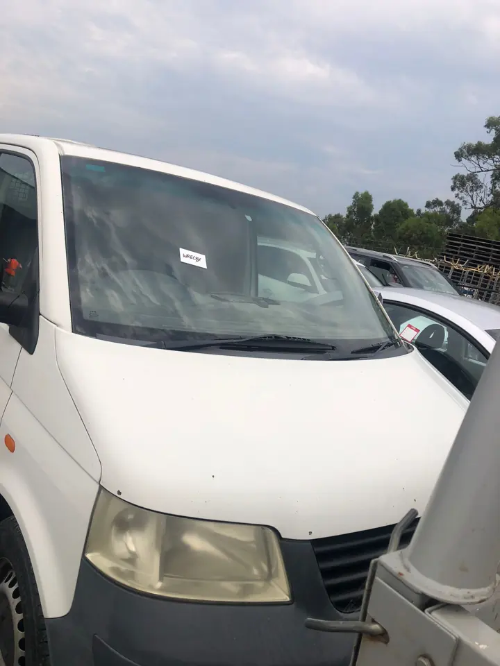 White van parked beside another vehicle