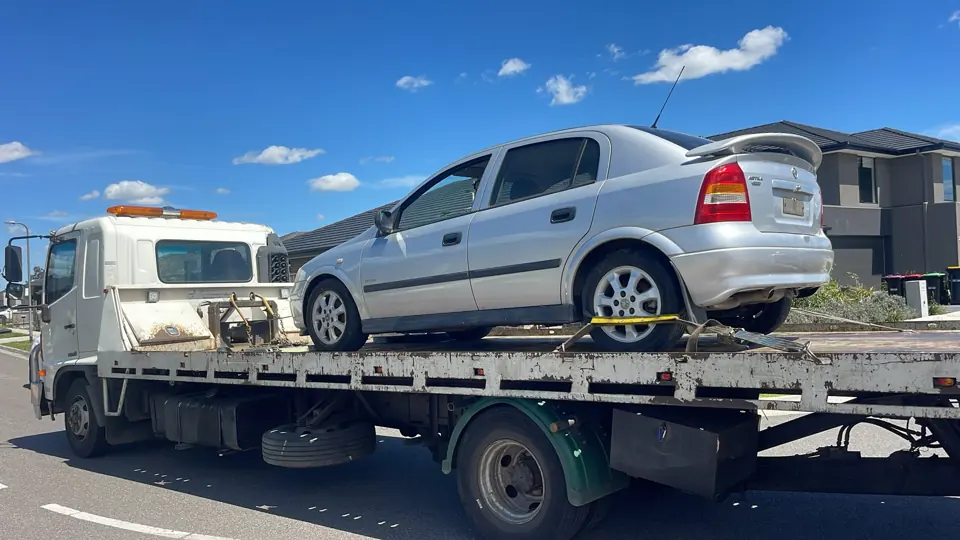 Silver SUV loaded on a flatbed