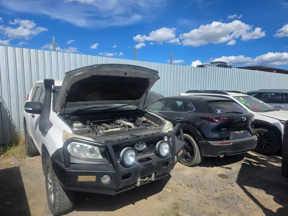 Dark vehicle with its bonnet open