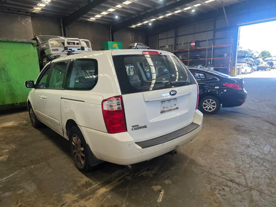 White SUV parked indoors