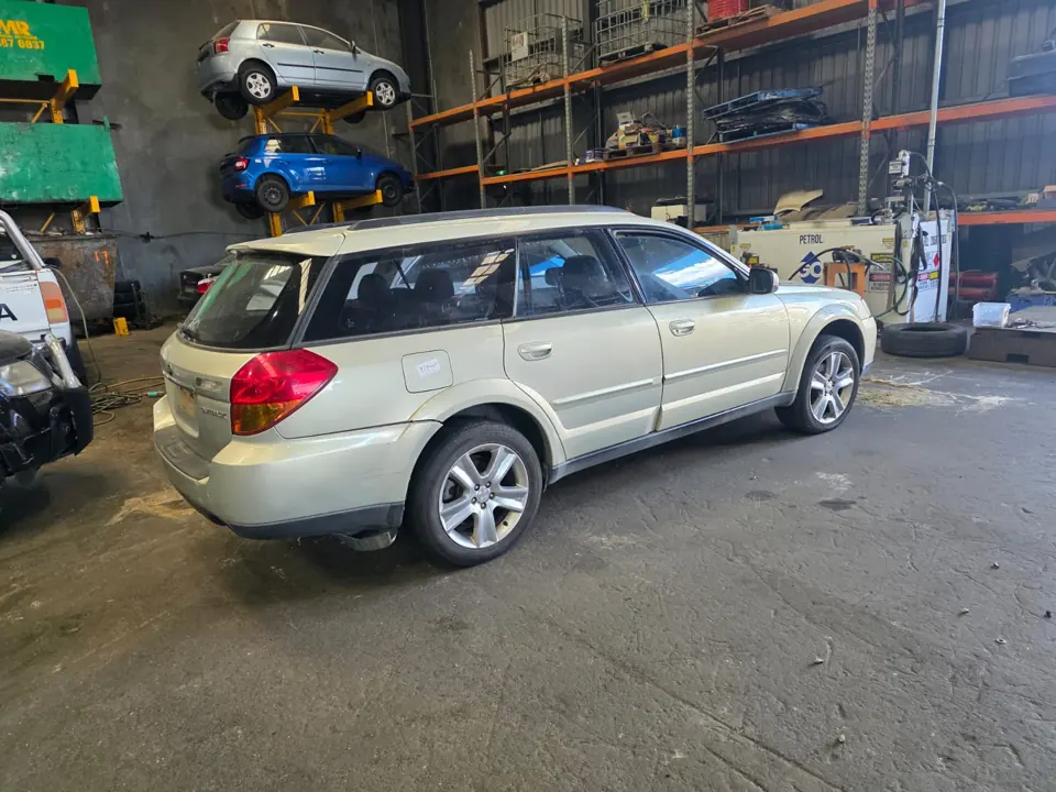 Silver sedan inside a workshop