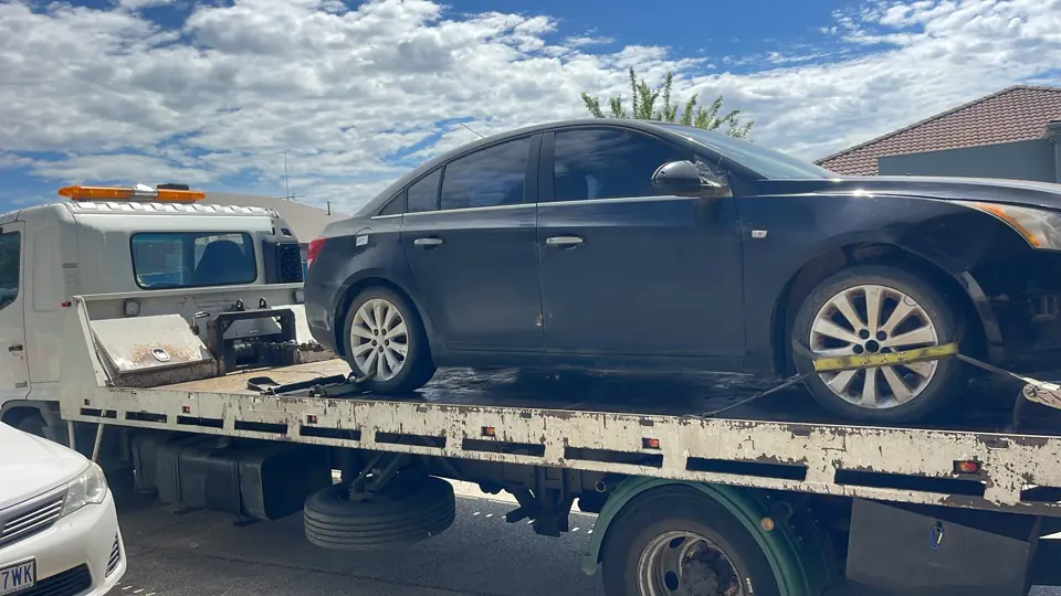 Dark sedan loaded for transport