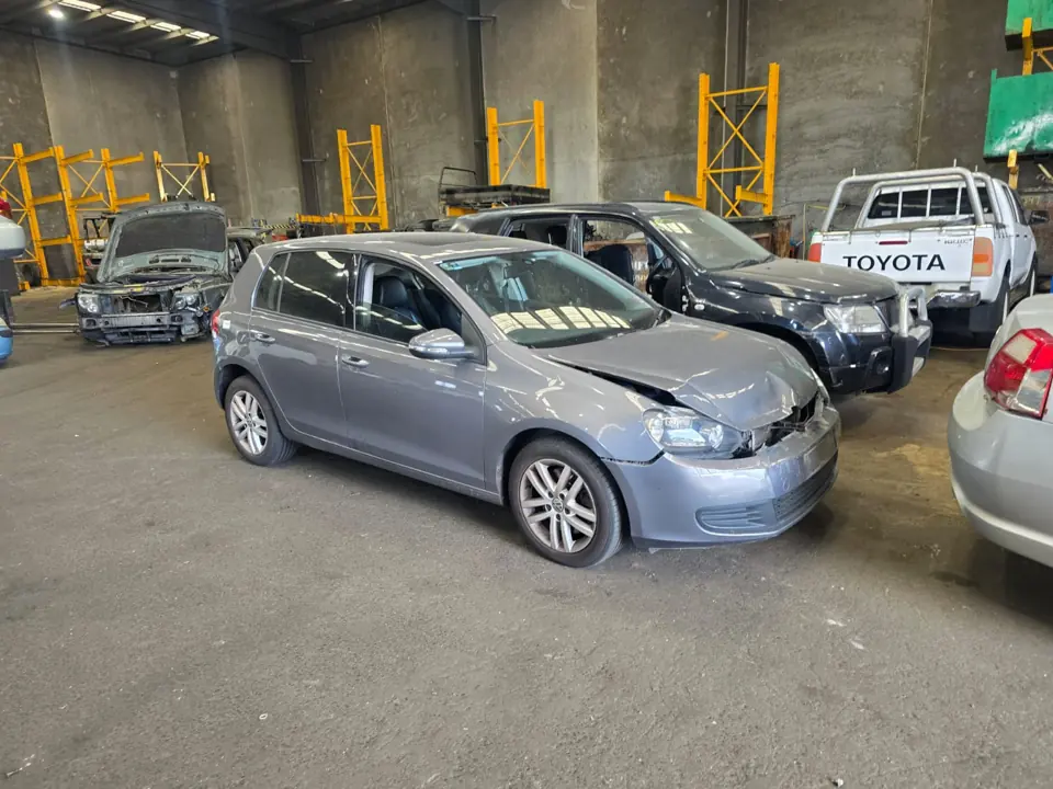 Silver sedan parked indoors