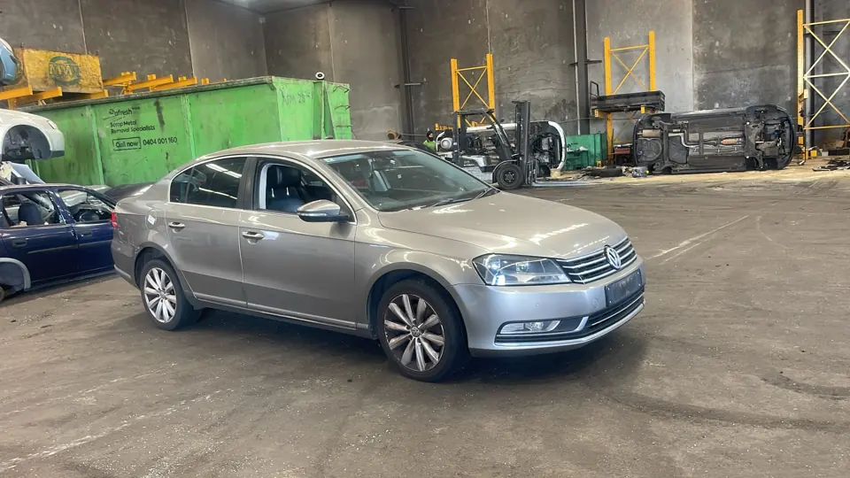 Silver sedan inside a workshop