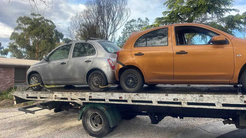 Orange car loaded for transport