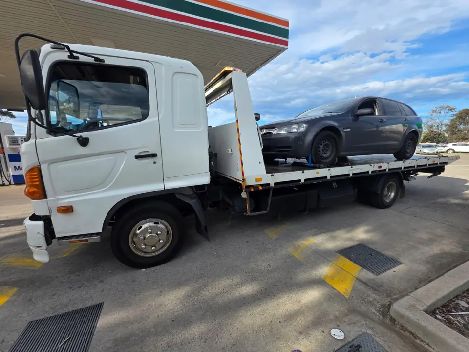 Vehicle beside a recovery truck