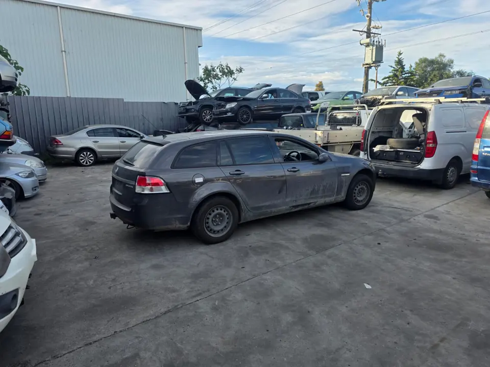 Dark car beside a flatbed