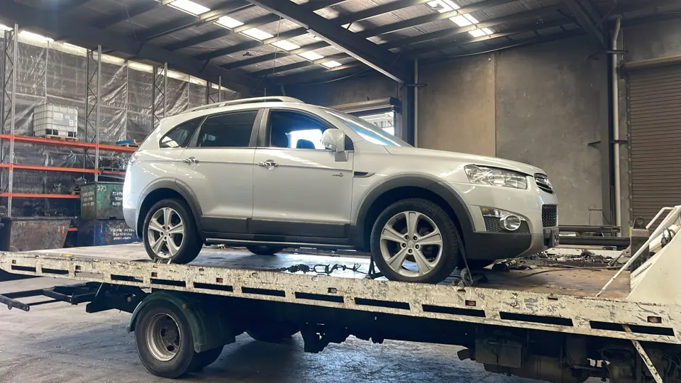 Silver SUV inside a workshop