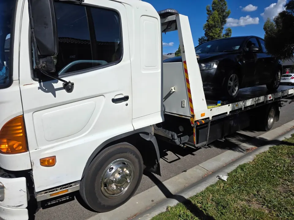 White flatbed recovery truck