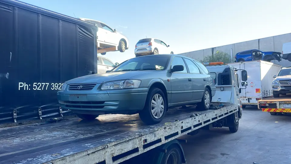 Silver car on a recovery truck