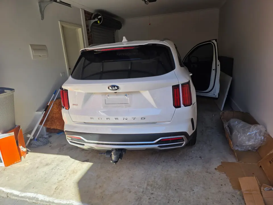 White SUV in a garage