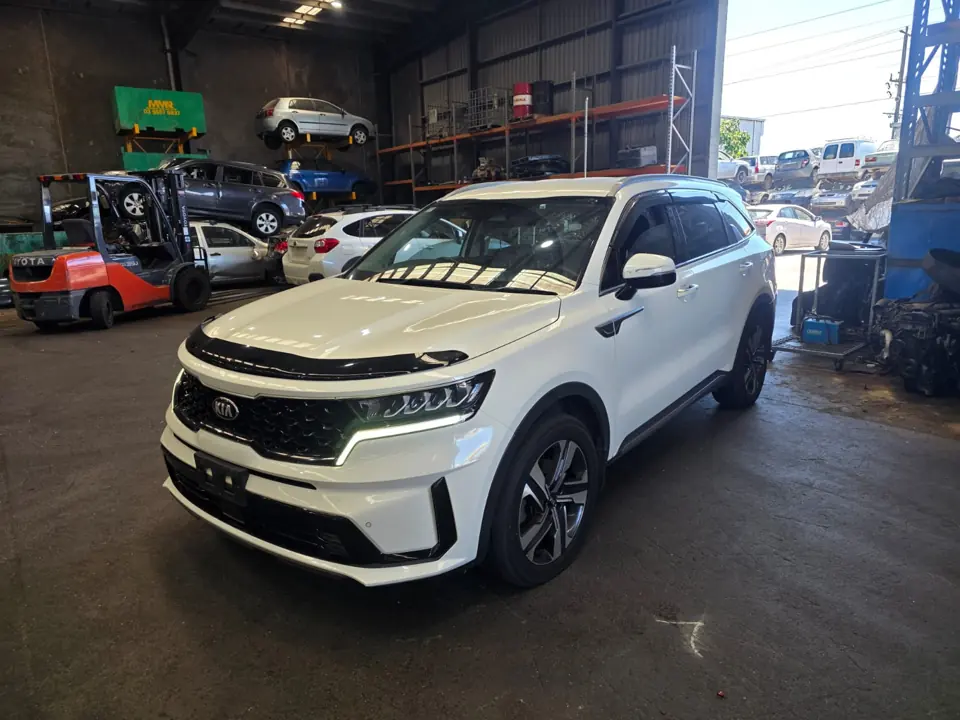 White vehicle parked indoors