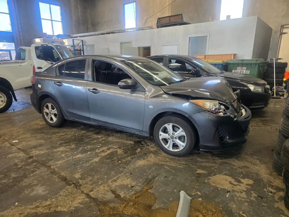 Dark sedan parked indoors