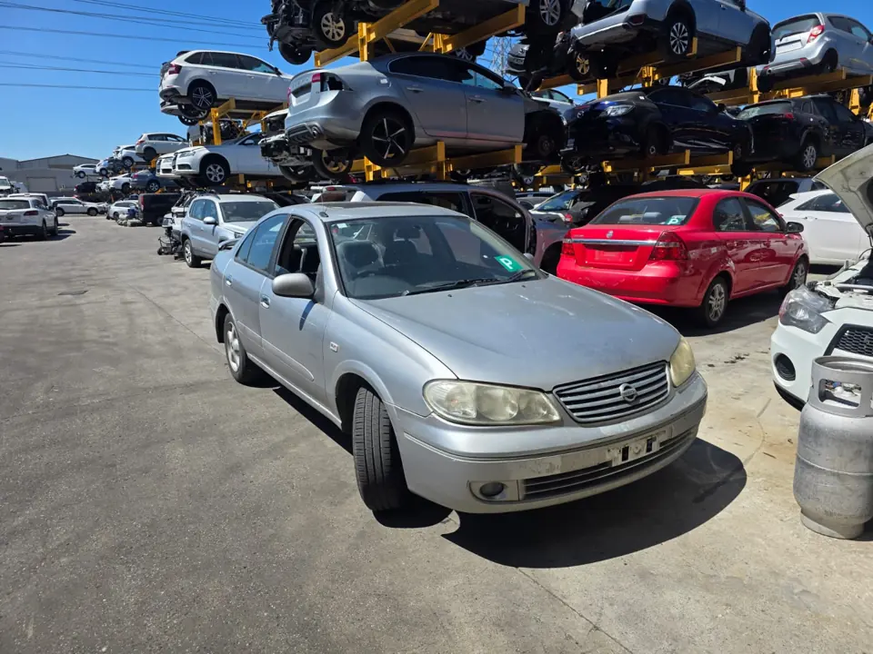 Silver sedan beside other cars