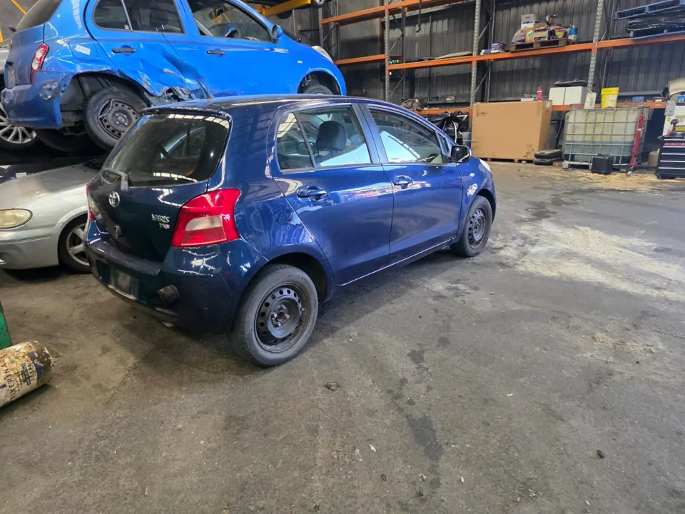 Blue car inside a workshop