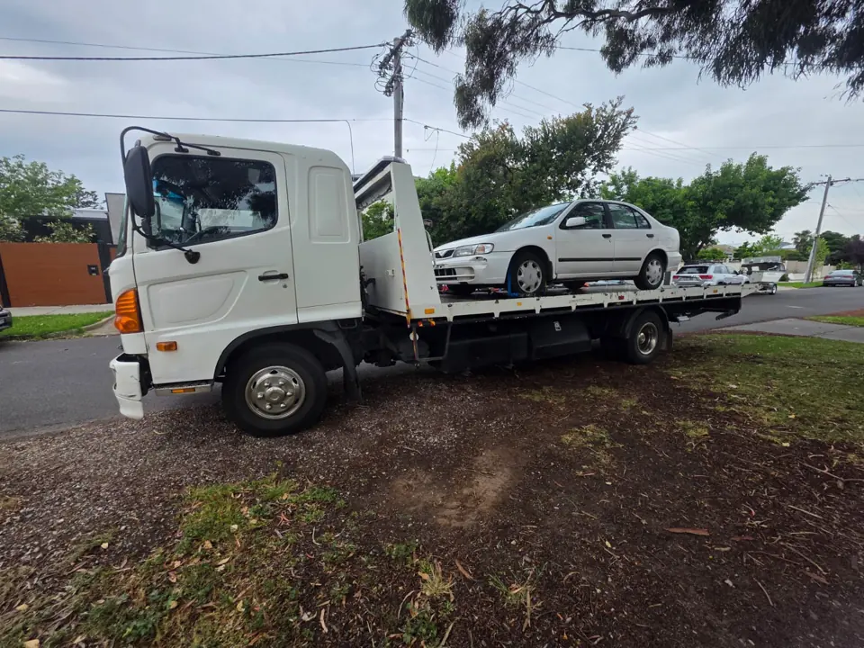 White flatbed recovery truck