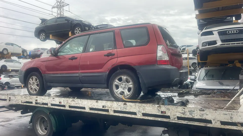 Red SUV loaded for transport