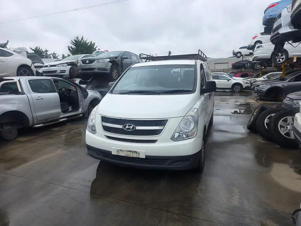 White van in a vehicle yard