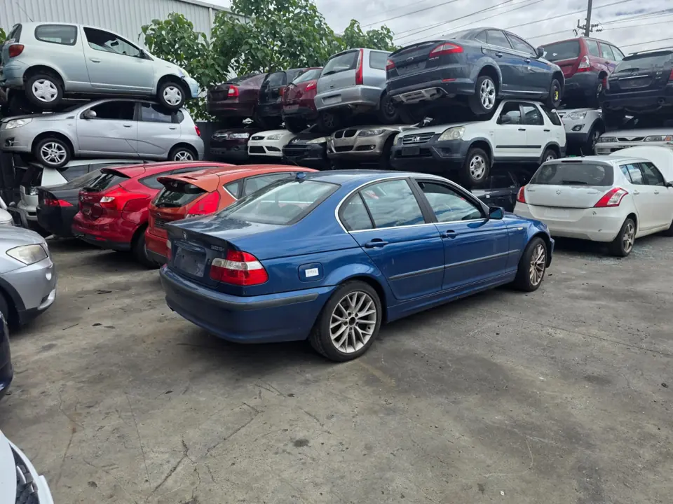 Dark sedan in a workshop