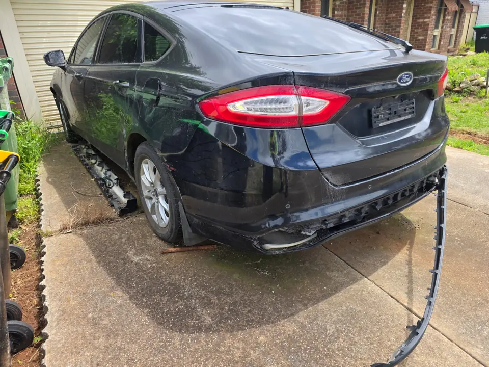 Dark sedan parked indoors