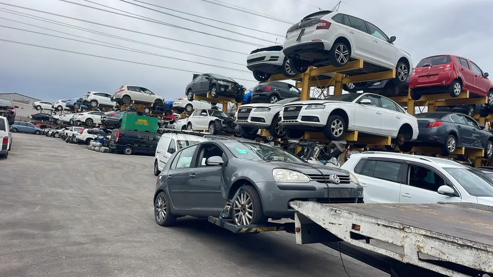 Silver car beside other vehicles