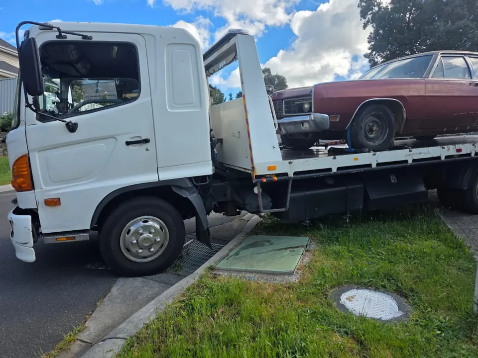 Vehicle on a flatbed transporter