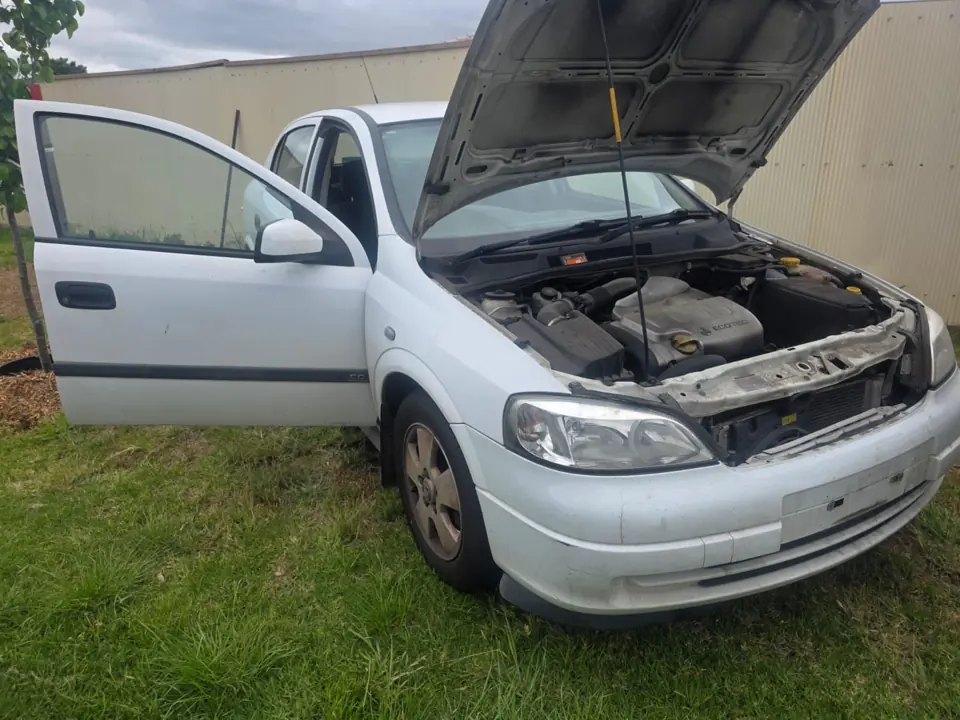 Silver car with its bonnet open