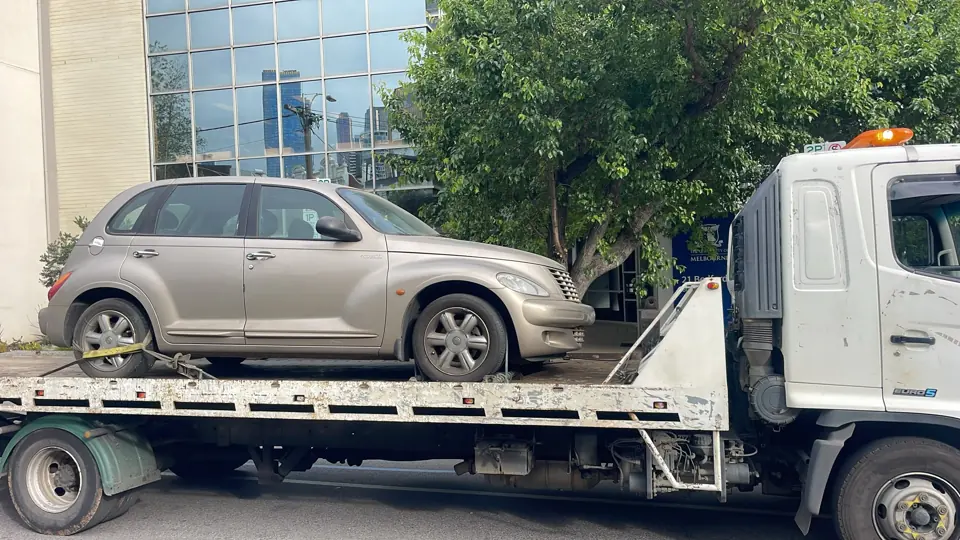 Silver SUV on a flatbed truck